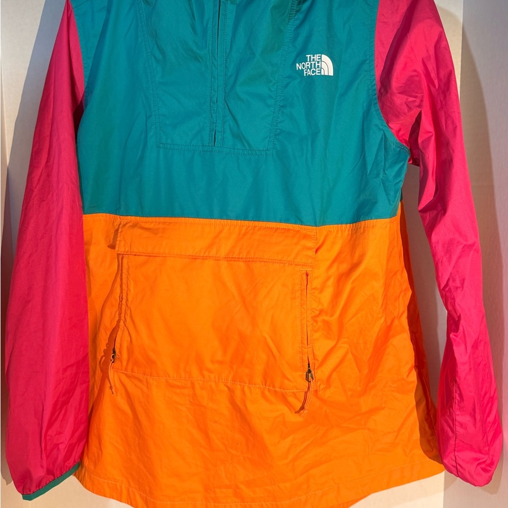 The North Face Women's Windbreaker that folds into a crossbody bag
